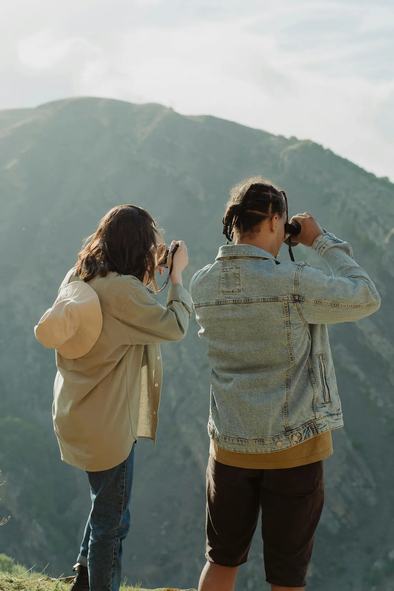 Small guided group watching wildlife from a golden English ridge